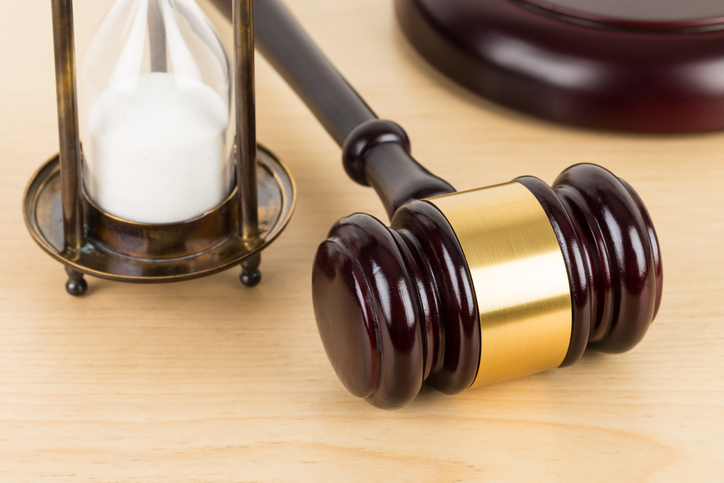 hourglass and gavel on desk